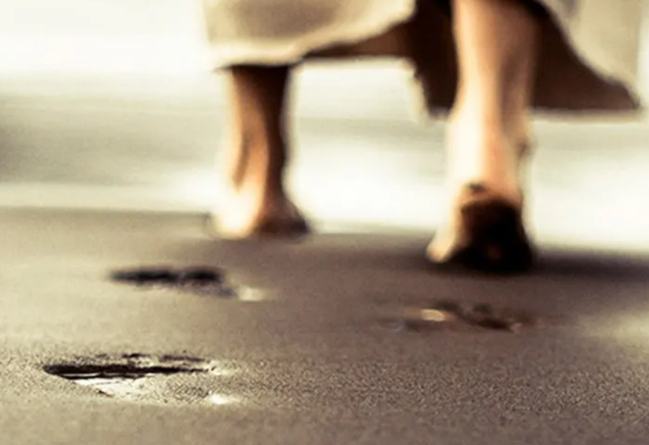 Bare feet walking across sand, illustrating the call to go and share the gospel